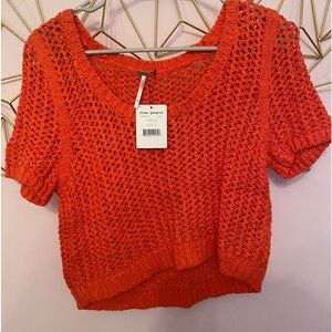 Free people small cropped crotchet sweater. More of a coral color. New with tags